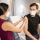 Experts warn vaccination alone won’t protect workers