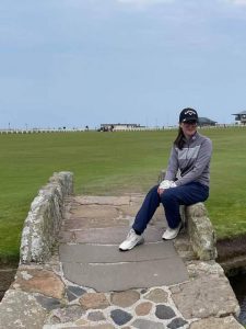 Chelsey pictured after her recent win at the Scottish Junior Open, sitting on the eminent Swilcan Bridge at St Andrews, between the first and eighteenth fairways on the Old Course.