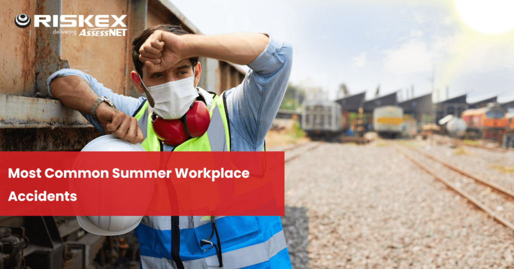 Copy of heat stress SM worker wiping his forehead in the heat outdoors wearing a hi-vis, mask and ear defenders around his neck.
