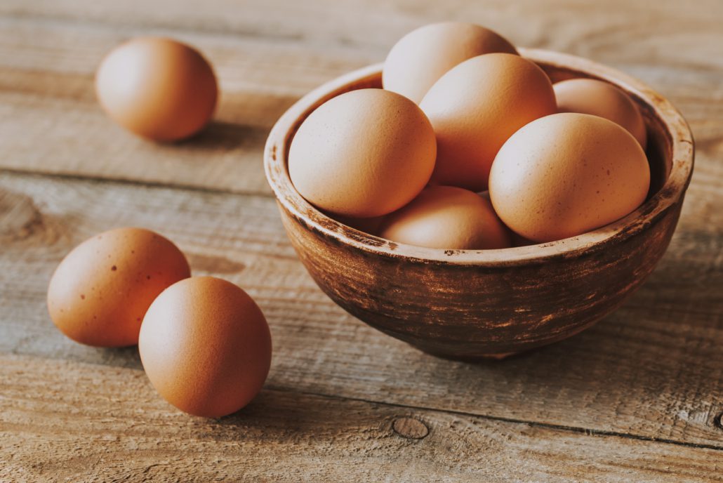 A wood bowl of eggs