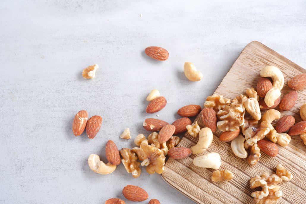 Mixed nuts on a wooden chopping board